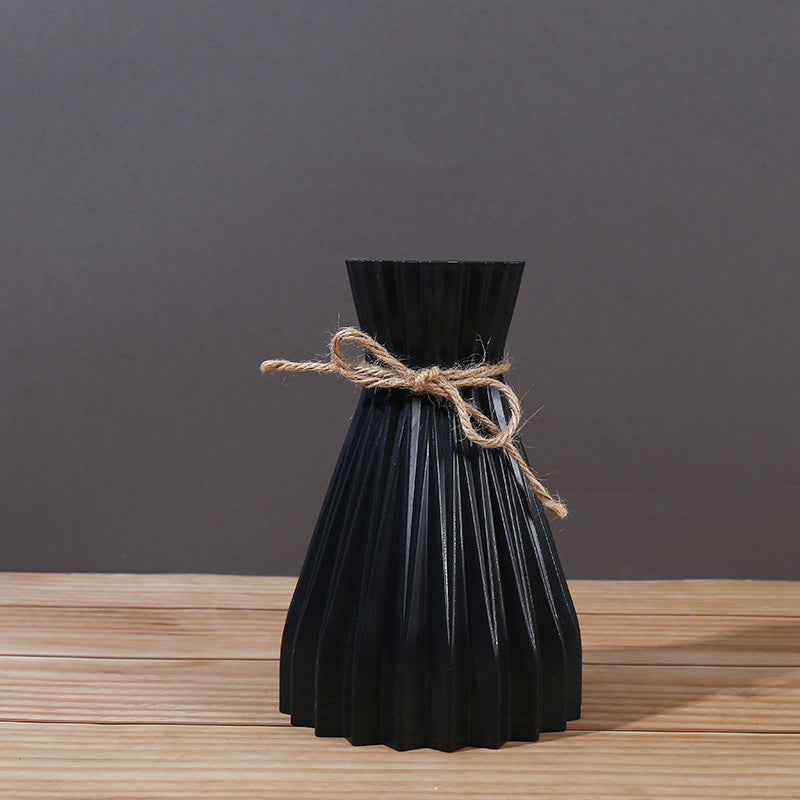 Cavira minimalist folded paper vase with twine detail, creative plastic flower arrangement for home decor and gifting.