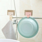 Pink and beige Cavira seamless wall-mounted washbasin hook rack made of ABS, punch-free bathroom basin hanger with multiple hooks.
