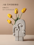 Ceramic vase with geometric abstract face design by Cavira, ideal for home decor, shelf styling, or gifting purposes.