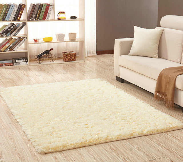 Cavira super soft shag area rug with modern silky polyester texture, ideal for living room, bedroom, or baby nursery flooring.