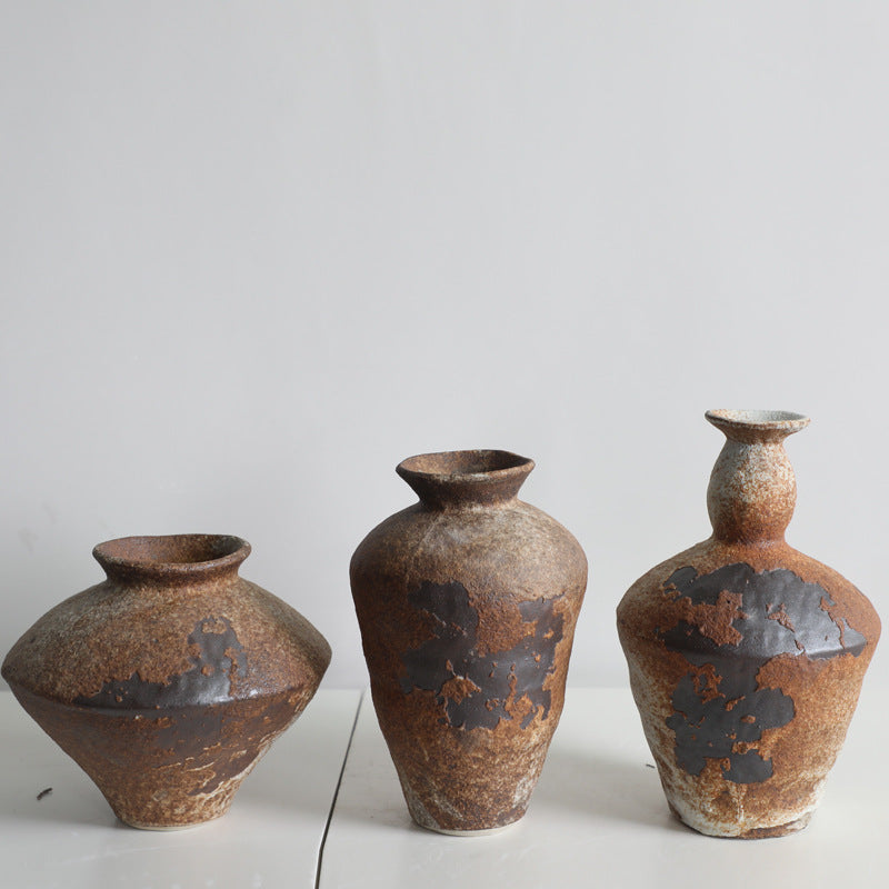 Rustic handmade ceramic vase with mottled glaze by Cavira, ideal for floral arrangements in Japanese, Zen, or Chinese-inspired home decor.