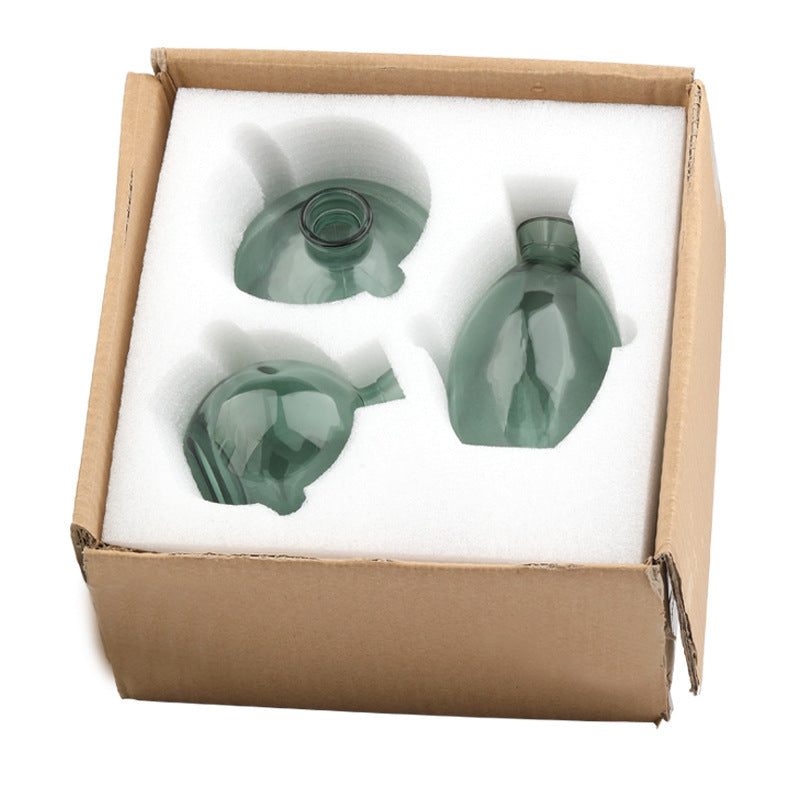 Set of three Cavira colour-dipped glass vases with light spray paint finish, perfect for home decor or gifting.