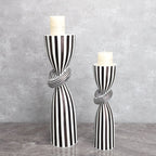 Black and white striped resin candle holder with modern irregular geometric design, perfect for home decor.