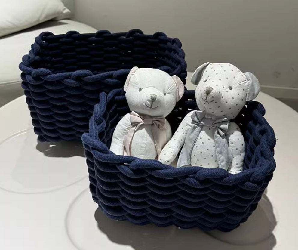 Set of three Cavira hand-woven cotton rope storage baskets in minimalist ink blue, nesting for living room, bedroom, or bathroom.