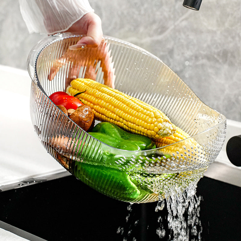Cavira multifunctional vegetable washing and drain basket made of PET plastic, used for rinsing fruits, vegetables, and draining rice.