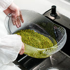 Cavira multifunctional vegetable washing and drain basket made of PET plastic, used for rinsing fruits, vegetables, rice, and salad.