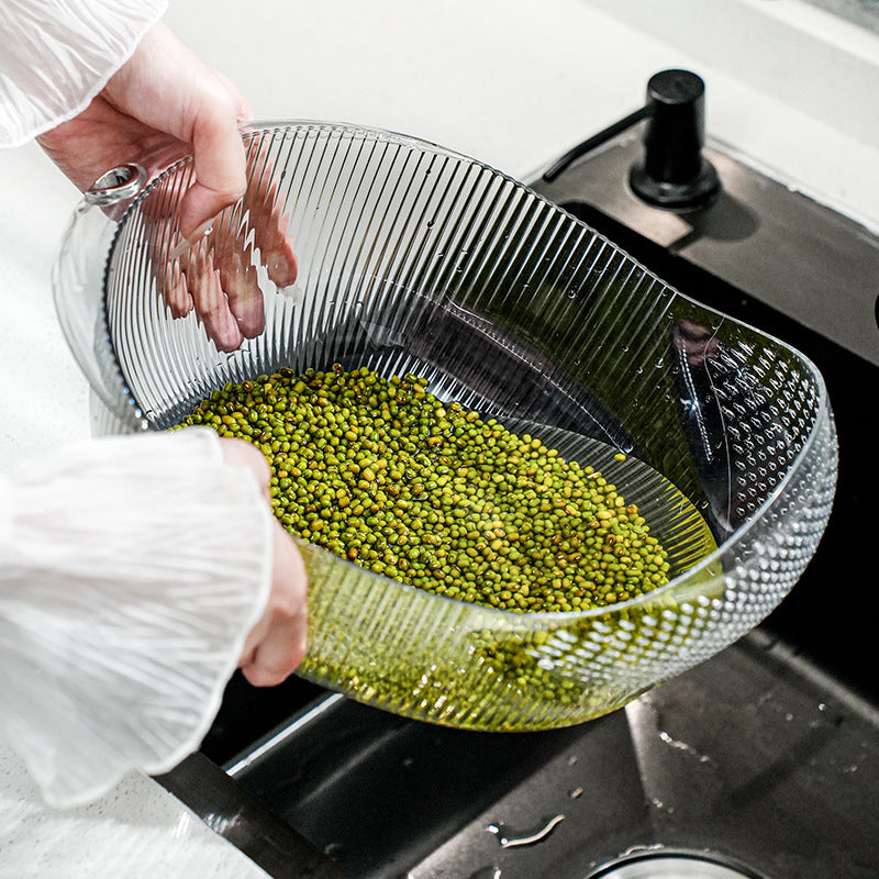 Cavira multifunctional vegetable washing and drain basket made of PET plastic, used for rinsing fruits, vegetables, rice, and salad.