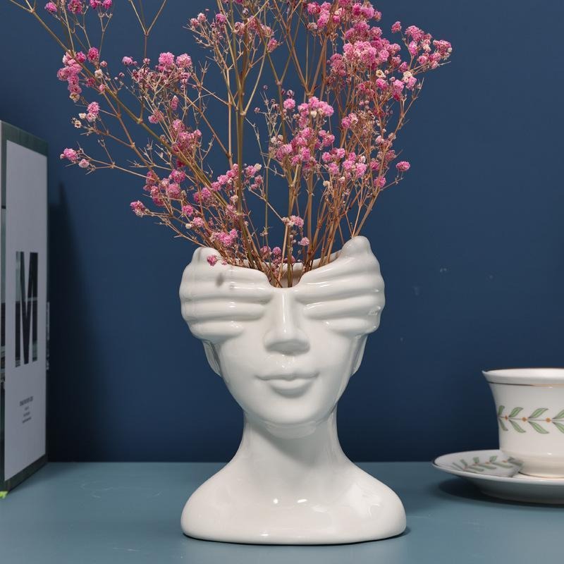 Ceramic art vase by Cavira featuring a Nordic sculptural human body figure for home decor, shelf styling, or gifting purposes.