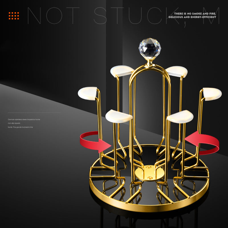 Cavira rotating inverted glass holder and drainer rack made of carbon steel for hanging wine glasses in kitchen or bar.