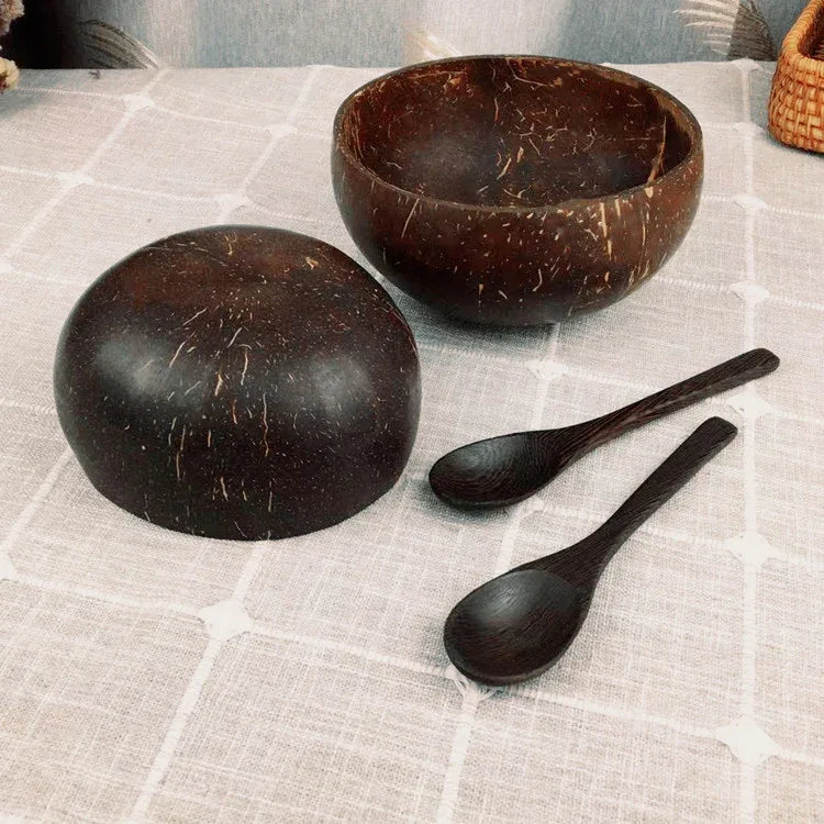 Handcrafted coconut shell bowl with wooden utensils, eco-friendly natural breakfast, smoothie, and salad bowl from eprolo.