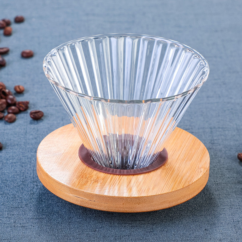 Coloured glass pour-over coffee dripper with wooden tray, part of Cavira's minimalist Japanese coffee set, 7 styles available.