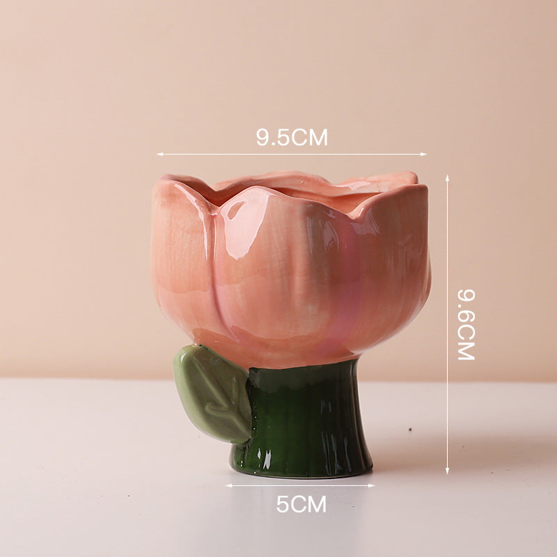 Cute ceramic succulent pot by Cavira with elephant, dinosaur, and flower designs, perfect for small plants on desk or balcony decor.