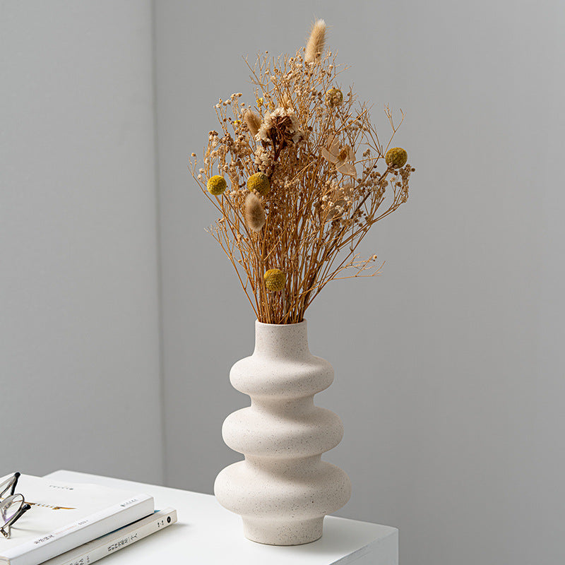 Frosted grain ceramic vase by Cavira with textured matte finish, ideal for flower arrangements and home decor.