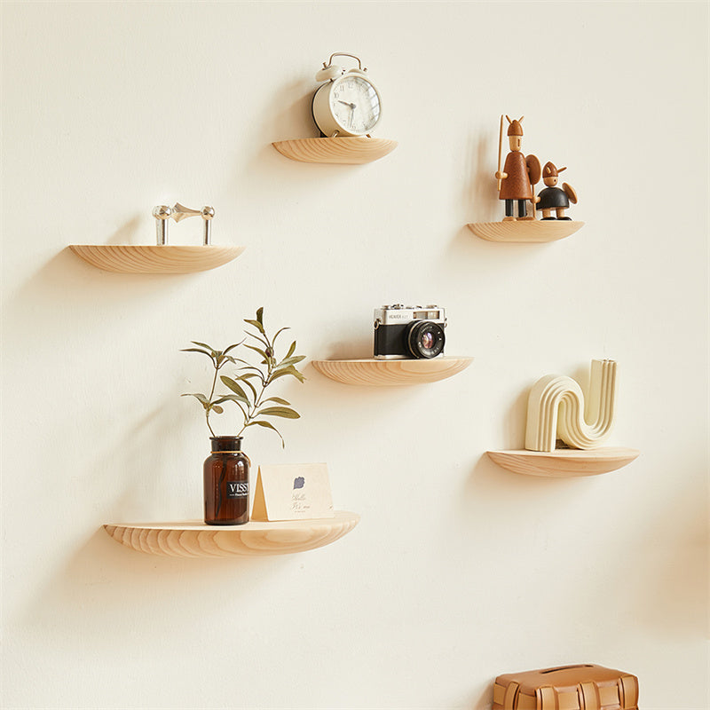 Cavira wooden semicircle wall shelf mounted on a wall, showcasing a stylish floating half circle display for home decor and storage.