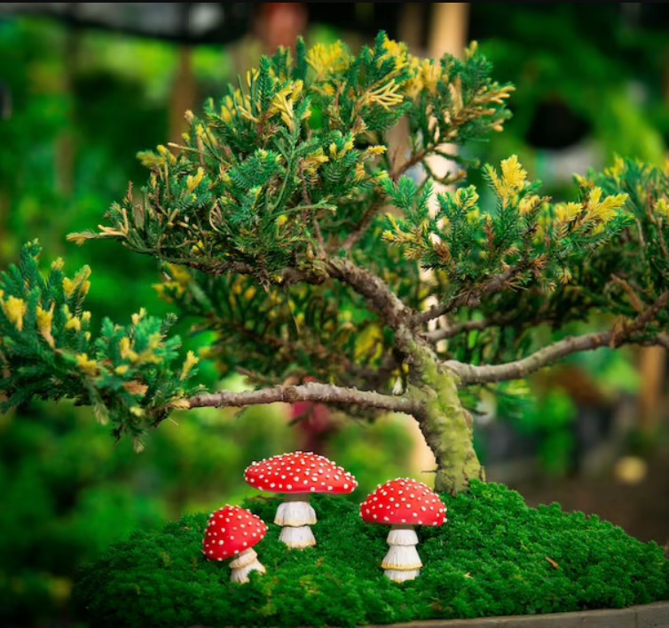 Set of glow-in-the-dark resin mushroom garden ornaments by Cavira, whimsical fairy garden decor for patios and outdoor spaces.