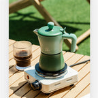 Cavira Moka Pot stovetop espresso maker in vibrant color, showcasing its compact design for rich Italian-style coffee brewing at home.