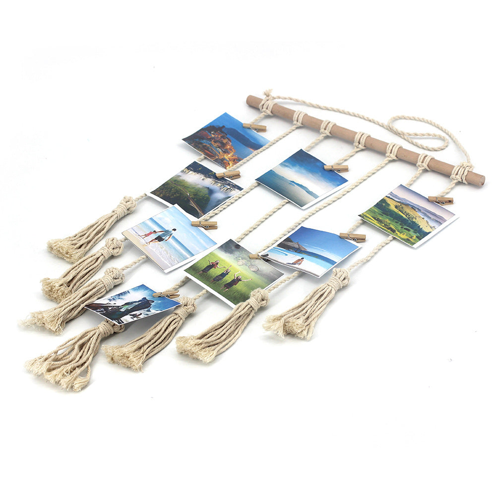 Handwoven cotton wall tapestry with photo clips, geometric boho design, wooden ring, and mini clips for bedroom or living room decor.