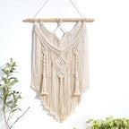 Natural macramé wall hanging tapestry by Cavira, handcrafted boho woven decor for bedroom, living room, or nursery walls.
