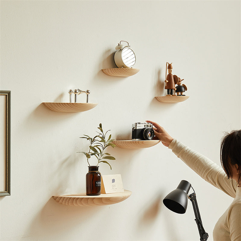 Wooden semicircle wall shelf by Cavira, floating half circle design for bedroom, living room, or home decor storage.