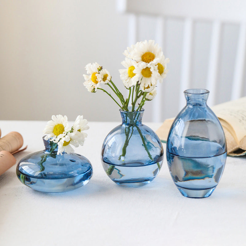 Set of three Cavira colour-dipped glass vases with light spray paint finish, ideal for home decor and floral arrangements.