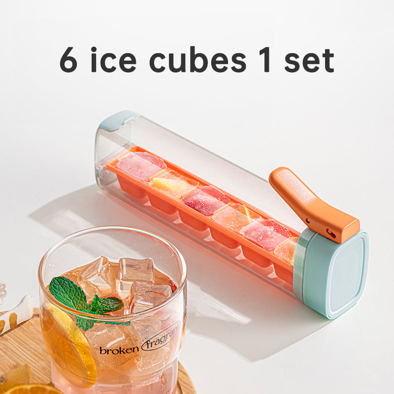 Large orange and green Cavira ice ball maker mold, food-grade PP and PC, creates slow-melt round ice spheres for whiskey and cocktails.