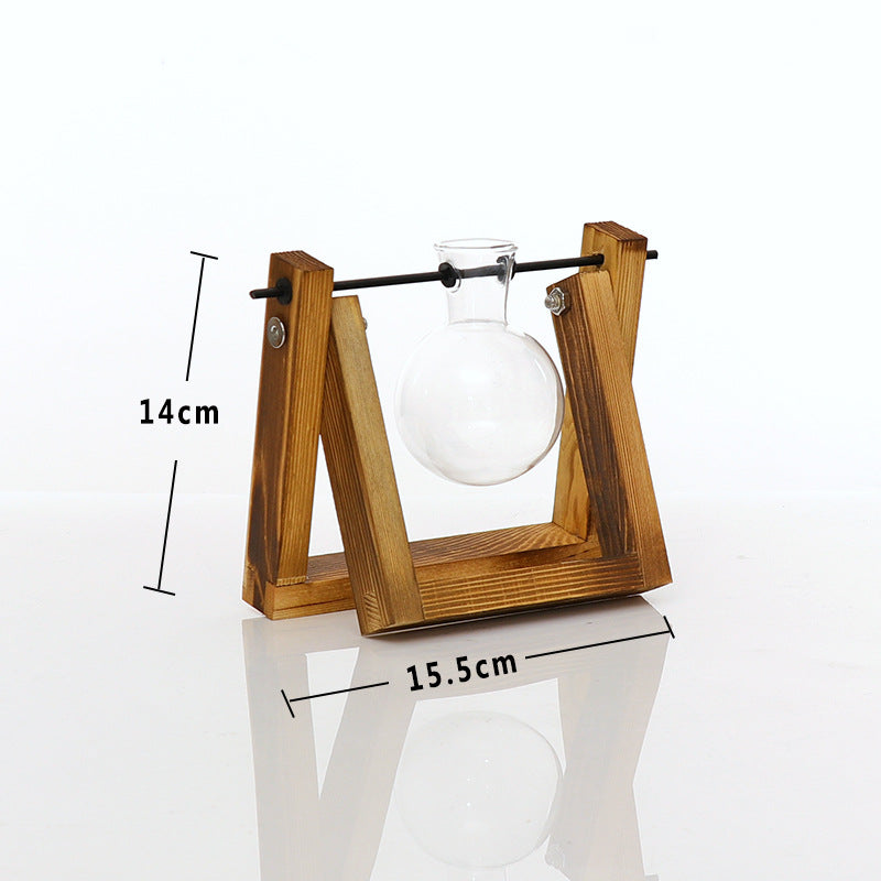 Cavira high borosilicate glass ball vase with retro wooden rack, used as a hydroponic planter or vintage desktop ornament.