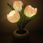 Cavira LED Tulip Ceramic Pot Night Light with faux tulip flower, 3 light modes, 5 colors, rechargeable battery, ideal for bedroom or desk decor.