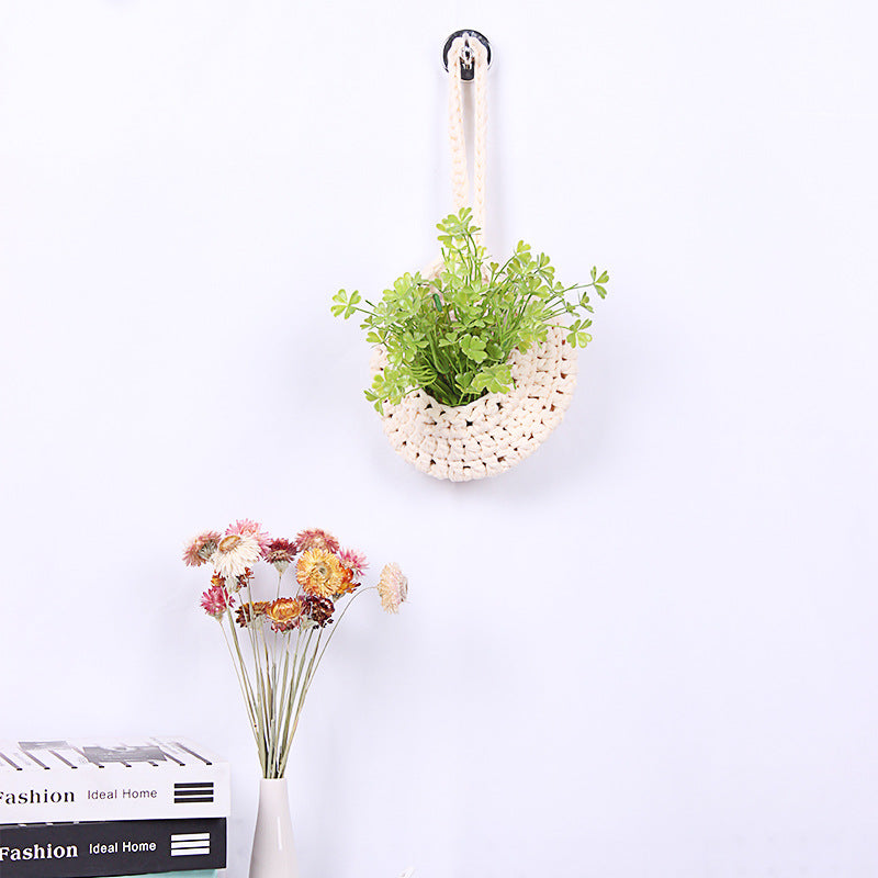 Handwoven boho cotton rope wall hanging net basket with woven flower design, ideal for home, bedroom, and living room decor.