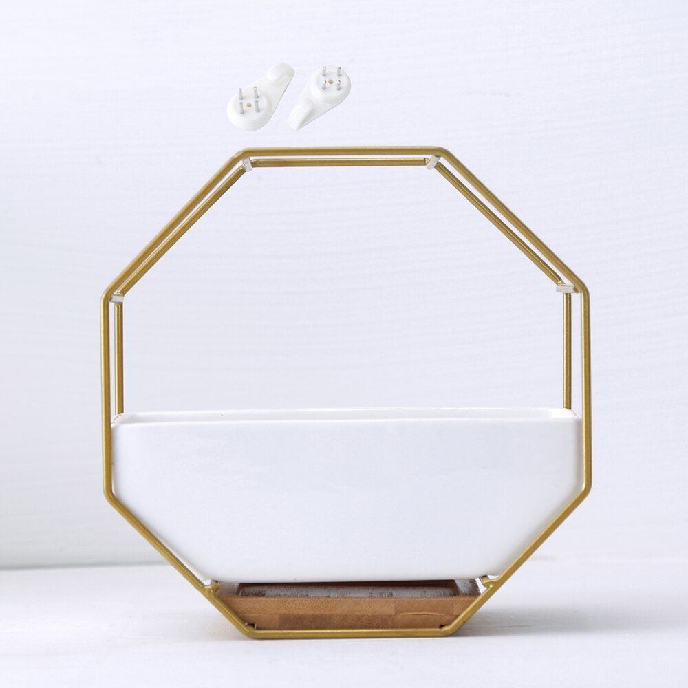 White ceramic octagonal wall hanging planter with iron frame and bamboo tray, perfect for indoor plants and boho minimalist decor.