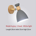 Nordic wooden iron bedside wall lamp by Cavira, minimalist wall light for bedroom, corridor, or restaurant decor.