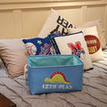 Canvas folding dinosaur storage basket by Cavira with embroidered cartoon dinosaur, ideal for kids' toys and stationery in nursery or bedroom