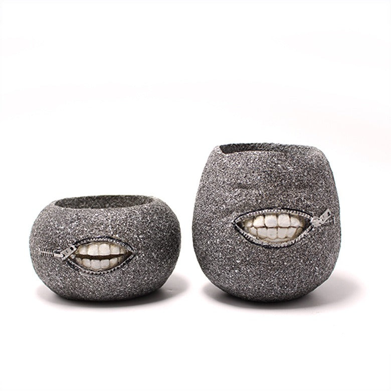 Set of two succulent-shaped resin planters by Cavira, decorative cactus and fleshy plant pots for indoor table and desk decor.