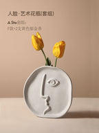 Geometric abstract face ceramic vase by Cavira featuring modern designer porcelain art for home decor and shelf styling.