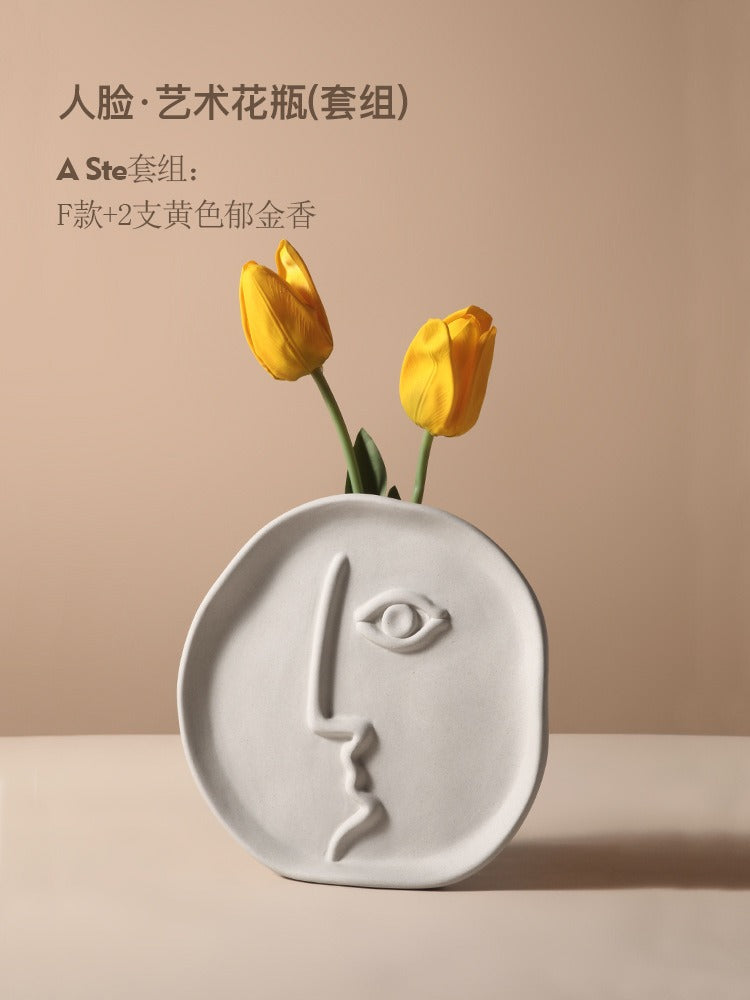 Geometric abstract face ceramic vase by Cavira featuring modern designer porcelain art for home decor and shelf styling.