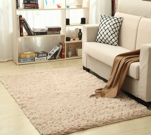Cavira super soft shag area rug with silky polyester texture, ideal for living room, bedroom, or nursery flooring.