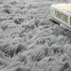 Super soft Cavira shag area rug with silky polyester fibers, ideal for living rooms, bedrooms, or nurseries.