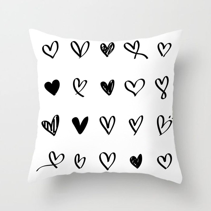 Geometric Jacquard knitted cushion cover in black, white, and grey polyester with modern design for sofa or home decor.