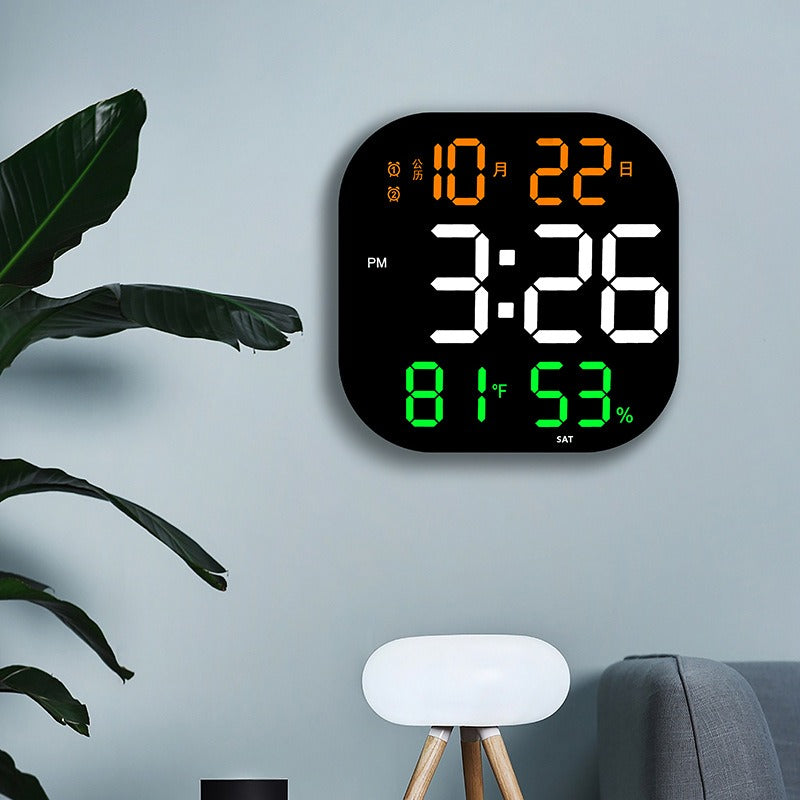 Cavira LED acrylic smart wall clock with digital display, thermometer, alarm, countdown, and night light in a modern living room setting