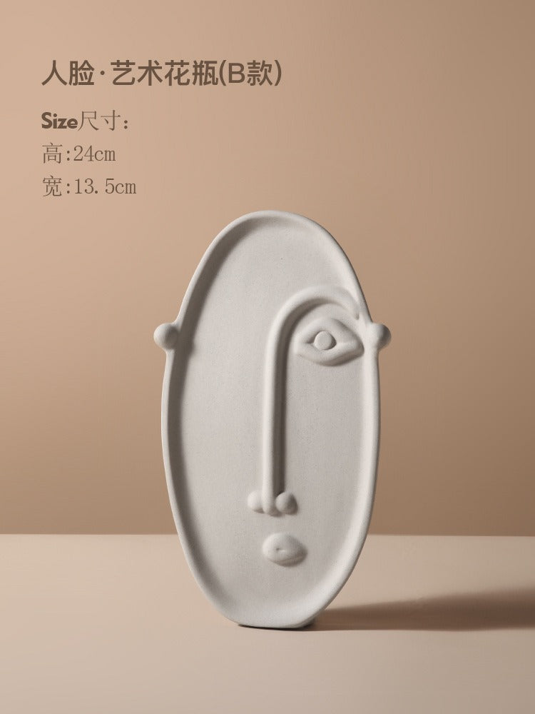 Ceramic vase with geometric abstract face design by Cavira, ideal for home decor, shelf styling, or gifting.