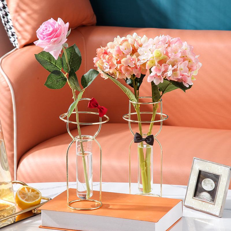 Gold and rose gold decorative glass vase by Cavira, featuring a creative design for flower arranging and home decor.
