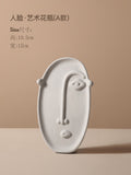 Ceramic vase with geometric abstract face design by Cavira, perfect for home decor, shelf styling, or gifting.