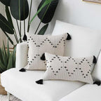 Hand embroidered bohemian throw pillow cover by Cavira, woven cotton cushion with minimalist design for sofa, bedroom, or living room.