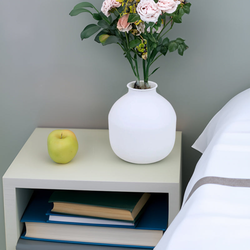 White matte metal vase with a unique sculptural shape, ideal for dried flowers, pampas grass, or floral arrangements.