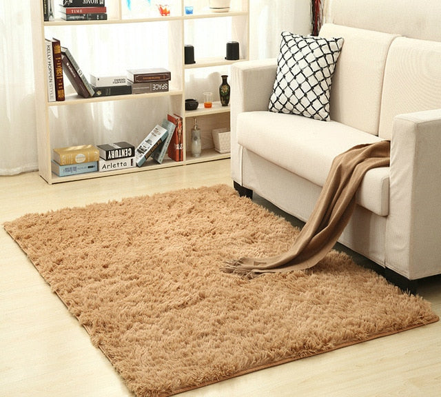 Cavira super soft shag area rug with silky polyester texture, modern design, ideal for living rooms, bedrooms, or nurseries.