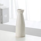 Set of three Cavira modern minimalist ceramic vases with sleek designs, perfect as decorative flower planters for home decor.