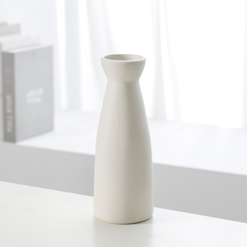 Set of three Cavira modern minimalist ceramic vases with sleek designs, perfect as decorative flower planters for home decor.