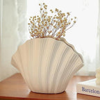 White porcelain ceramic vase by Cavira, modern minimalist design for hydroponic flower arrangements and home decor.