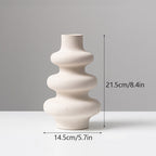 Frosted grain ceramic vase by Cavira with textured matte finish, ideal for flower arrangements and home decor.