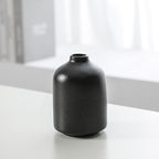 Set of three Cavira modern minimalist ceramic vases with smooth finishes, ideal for floral arrangements and home decor displays.