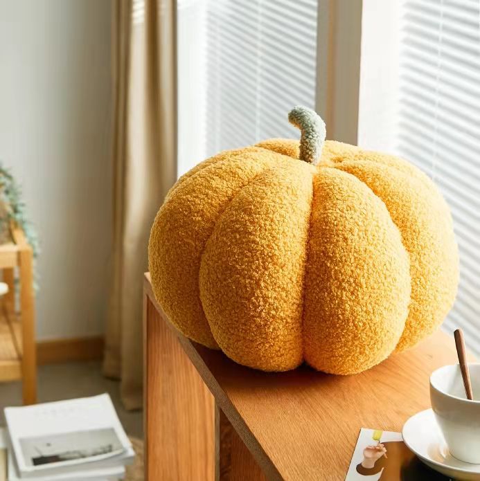 Soft plush pumpkin pillow by Cavira, round sofa cushion perfect for living room, bedroom, and home decor.